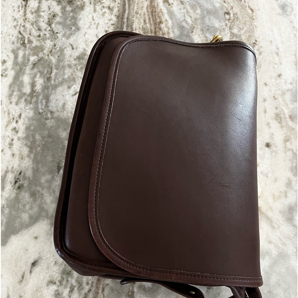 Coach vintage (early 2000’s) brown leather classic shoulder saddle bag.